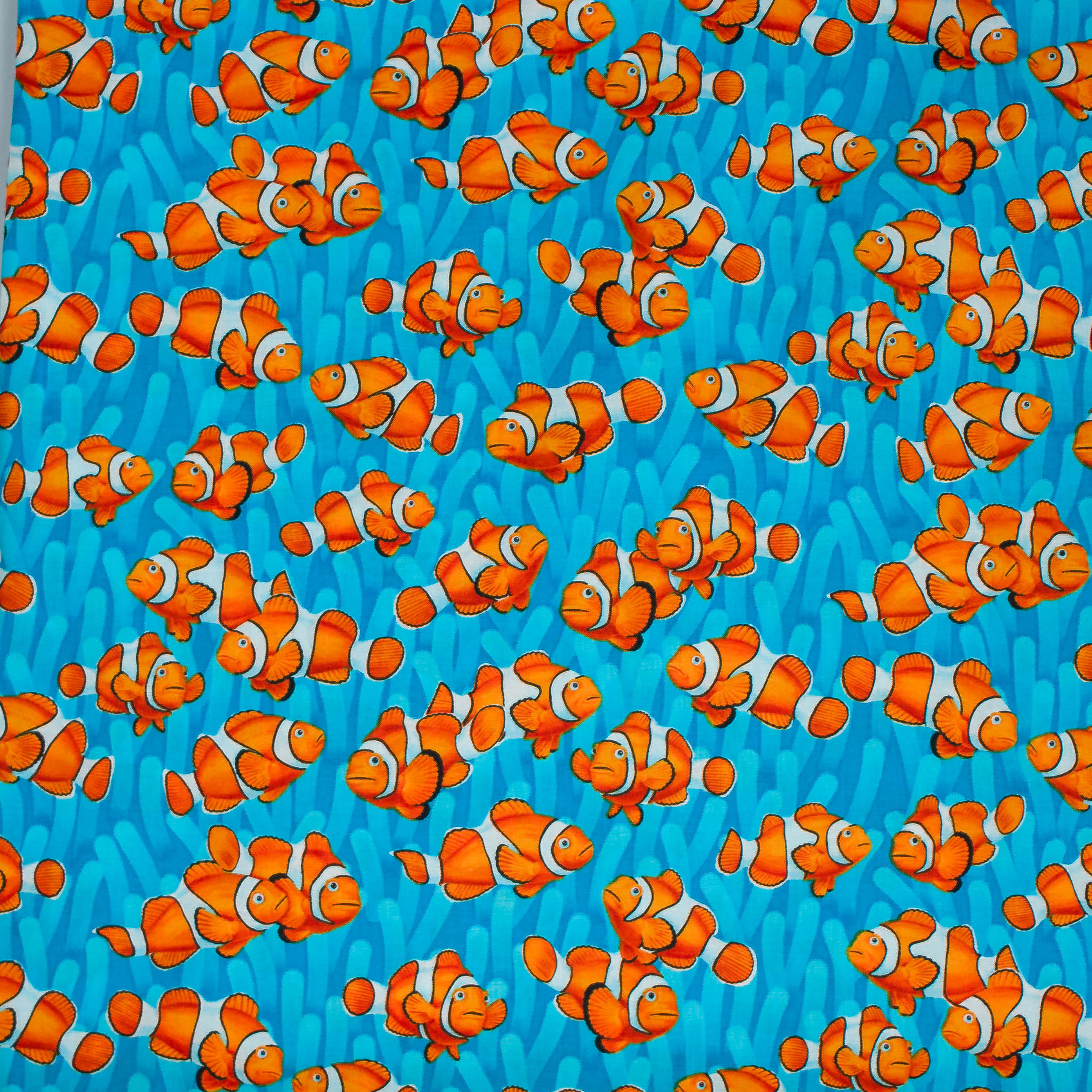 Katoen blauw met getekende clownvissen